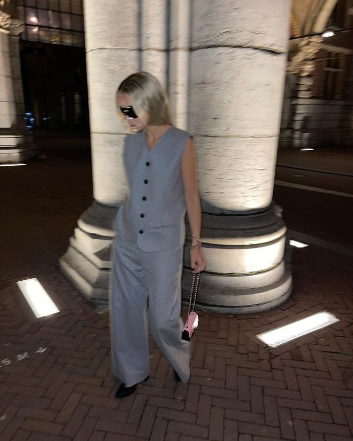 Wedding guest outfit trends 2023: @stephaniebroek wears a grey waistcoat and tailored trousers