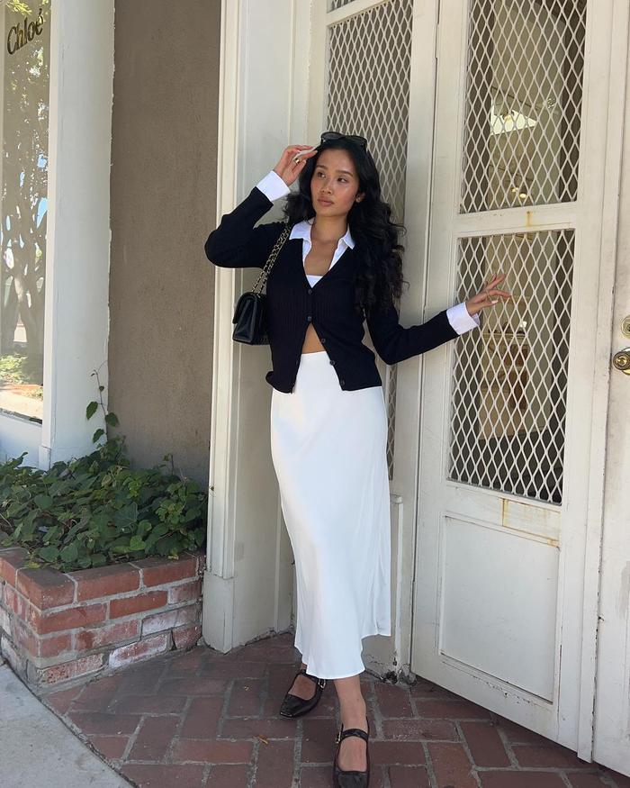 8 Midi-Skirt Outfits Fashion People Are Wearing Now: @kristincabat wears a midi skirt and cardigan